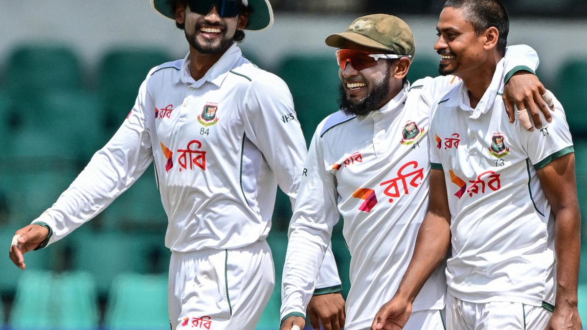 Bangladesh's Taijul Islam (R) celebrates with his captain Najmul Hossain Shanto (L) and teammate Mushfiqur Rahim after taking the wicket of Sri Lanka's Tharindu Ratnayake during the third day of the second Test cricket match between Sri Lanka and Bangladesh at the Sinhalese Sports Club (SSC) Ground in Colombo on June 27, 2025