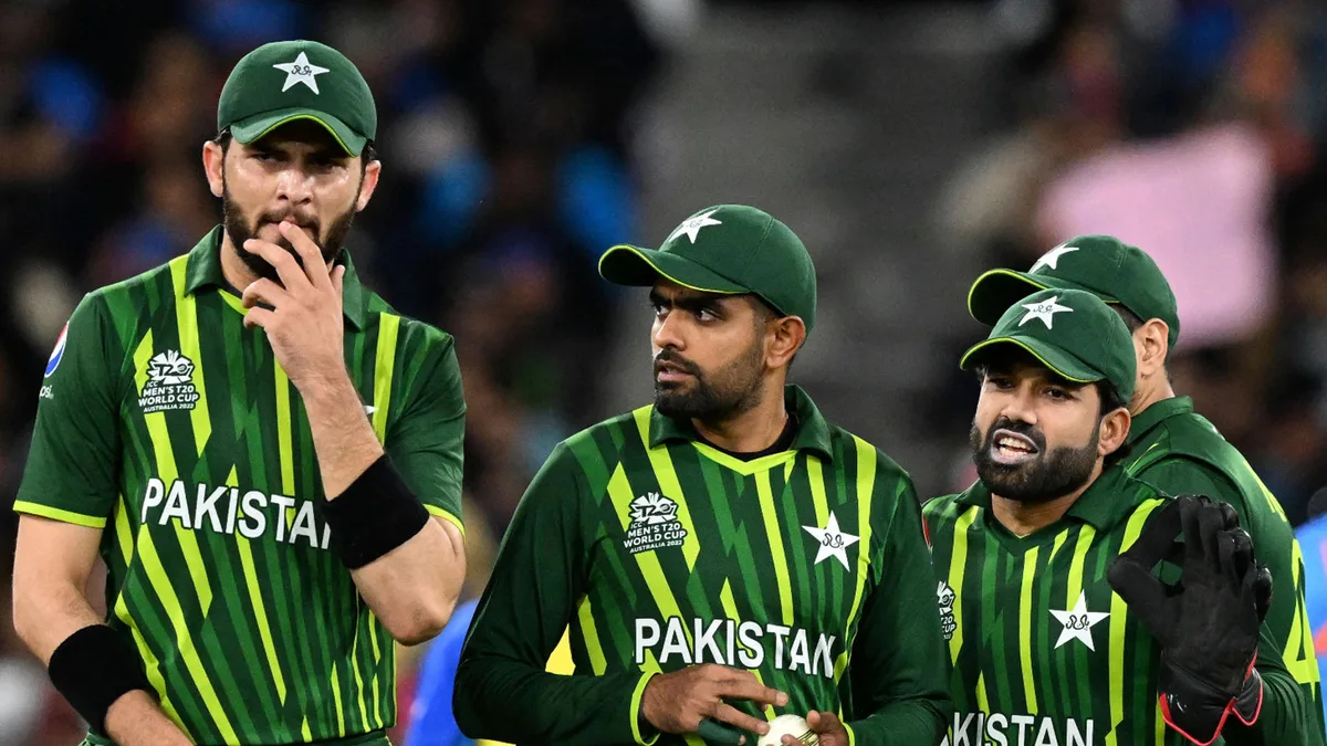 Shaheen Shah Afridi, Babar Azam and Muhammad Rizwan, walk back to their fielding positions during the ICC men's Twenty20 World Cup 2022 cricket match between India and Pakistan at Melbourne Cricket Ground (MCG) in Melbourne on October 23, 2022