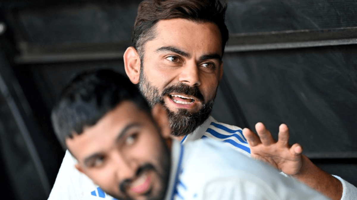 Virat Kohli and Devdutt Padikkal relax in the dugout