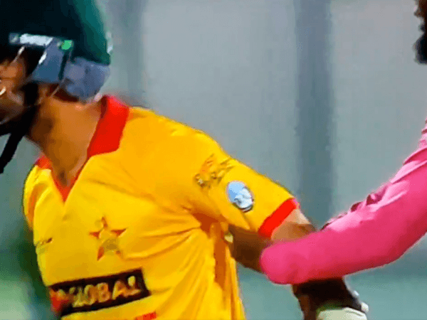 sikandar-raza-banned-after-umpire-holds-him-back-during-spat-with-ireland-players.Click to read full article.