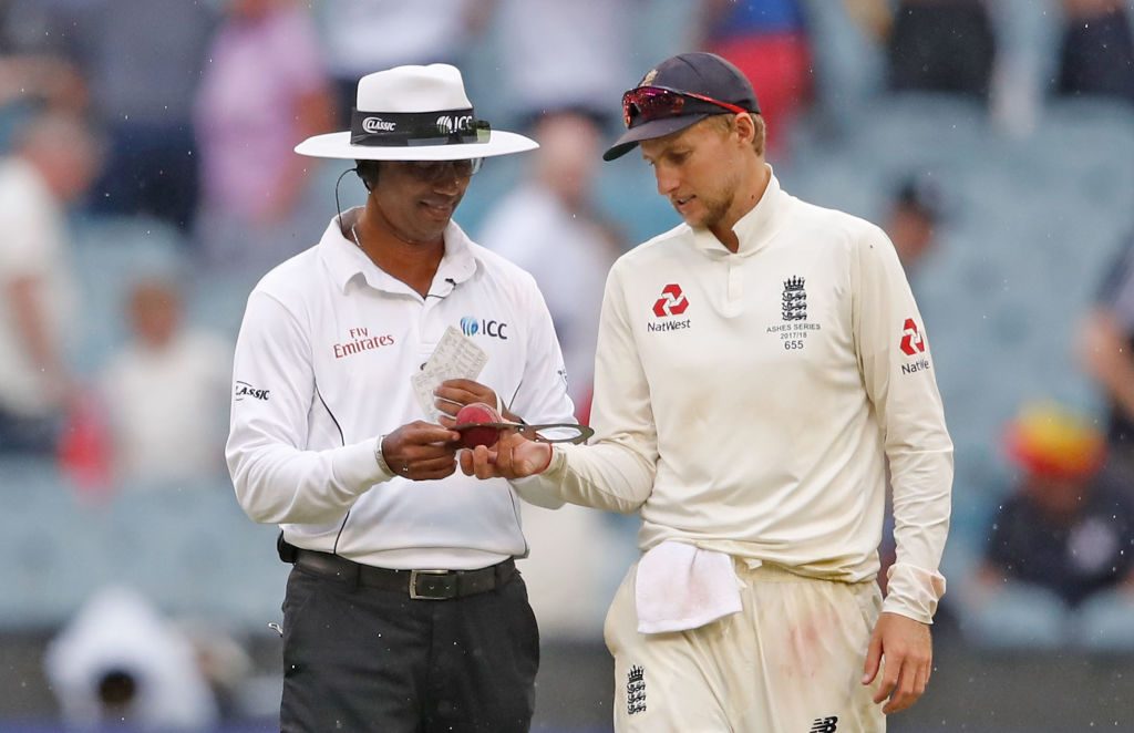 Joe Root and umpire Kumar Dharmasena inspect the ball