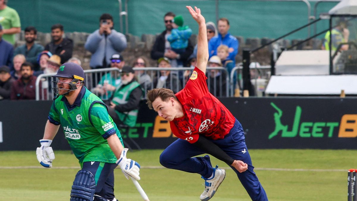 England's Sonny Baker bowls during the third Twenty20 International cricket match between Ireland and England at Malahide cricket club in Dublin on September 21, 2025