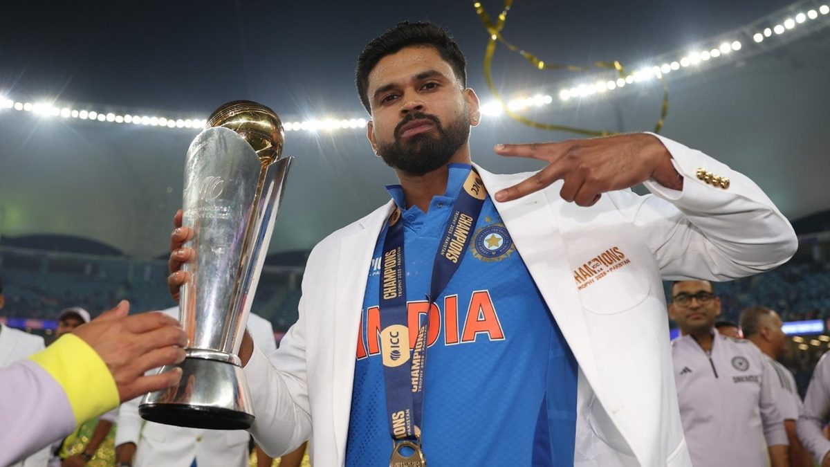 Shreyas Iyer poses with the Champions Trophy