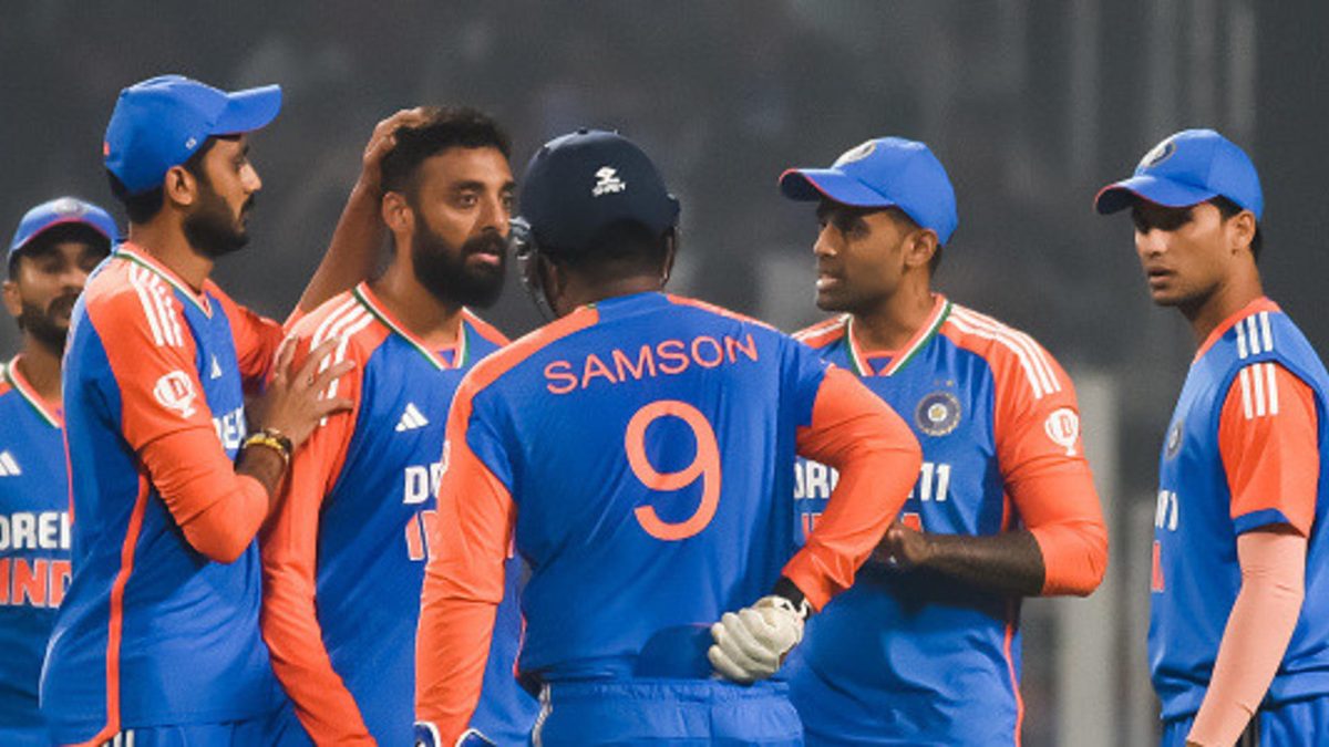 Varun Chakaravarthy of India celebrates with teammate Washington Sundar after dismissing Liam Livingstone of England during the T20 International match between India and England at Eden Gardens in Kolkata, India, on January 22, 2025