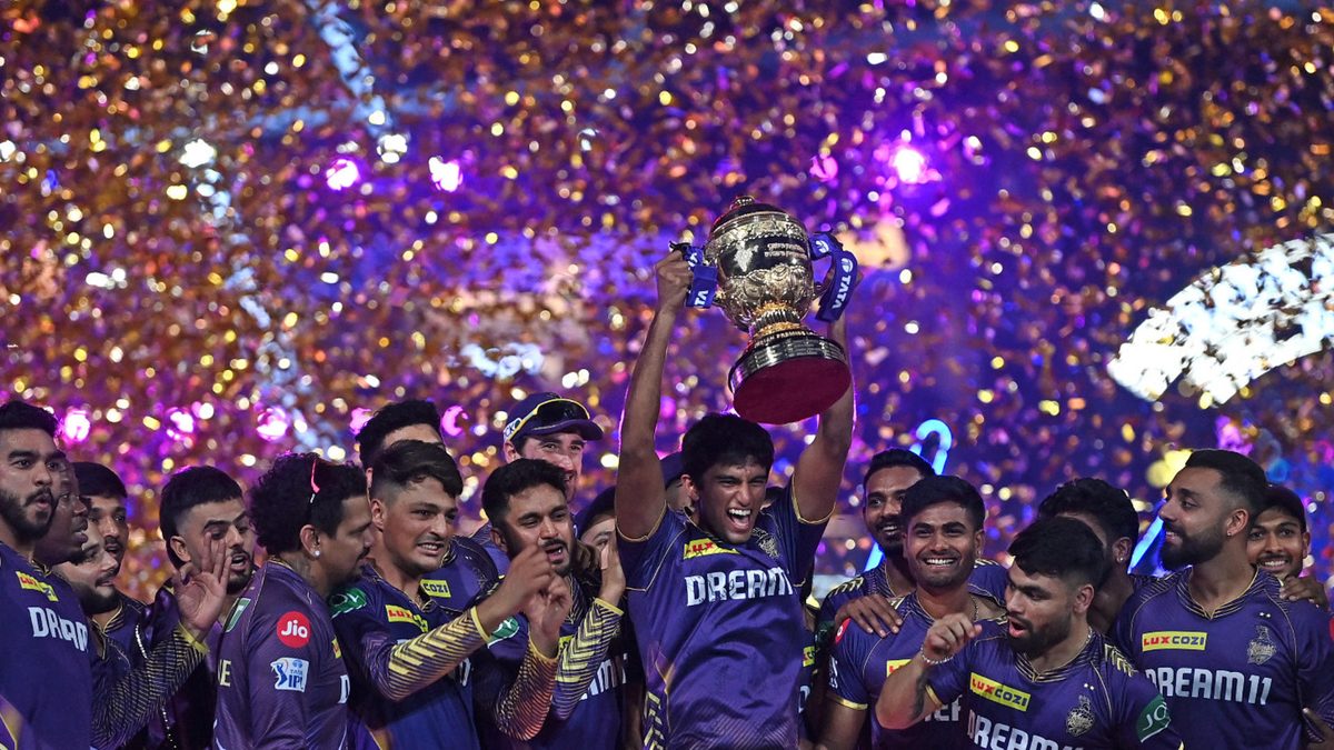 Kolkata Knight Riders' players celebrate with the trophy after winning the Indian Premier League (IPL) Twenty20 final cricket match against Sunrisers Hyderabad at the MA Chidambaram Stadium in Chennai on May 26, 2024
