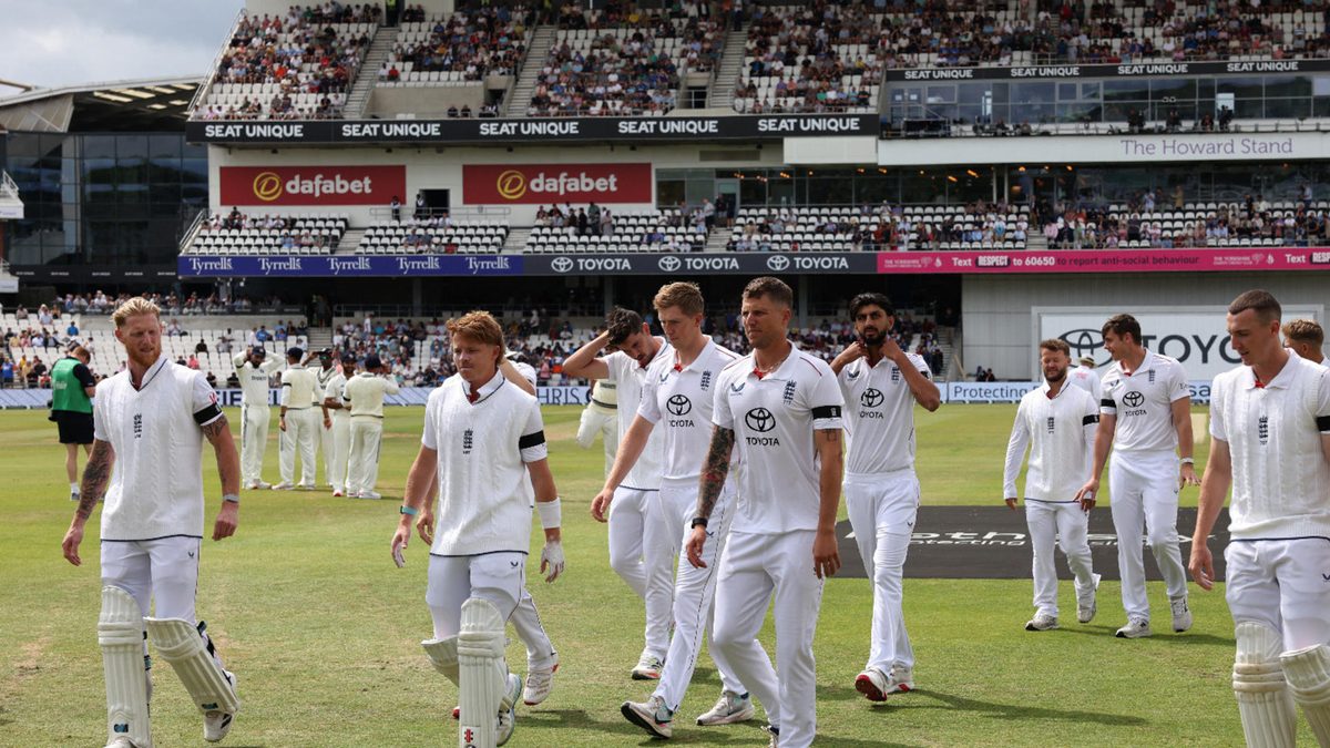 The England team leave the field after observing a minute's applause to honour the life of former England cricketer Dave 'Syd' Lawrence on day three of the first cricket test match between England and India at Headingley cricket ground in Leeds, northern England on June 22, 2025