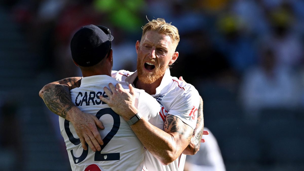 England captain Ben Stokes celebrates with Brydon Carse after dismissing Travis Head of Australia during day one of the First 2025/26 Ashes Series Test Match between Australia and England at Perth Stadium on November 21, 2025 in Perth, Australia