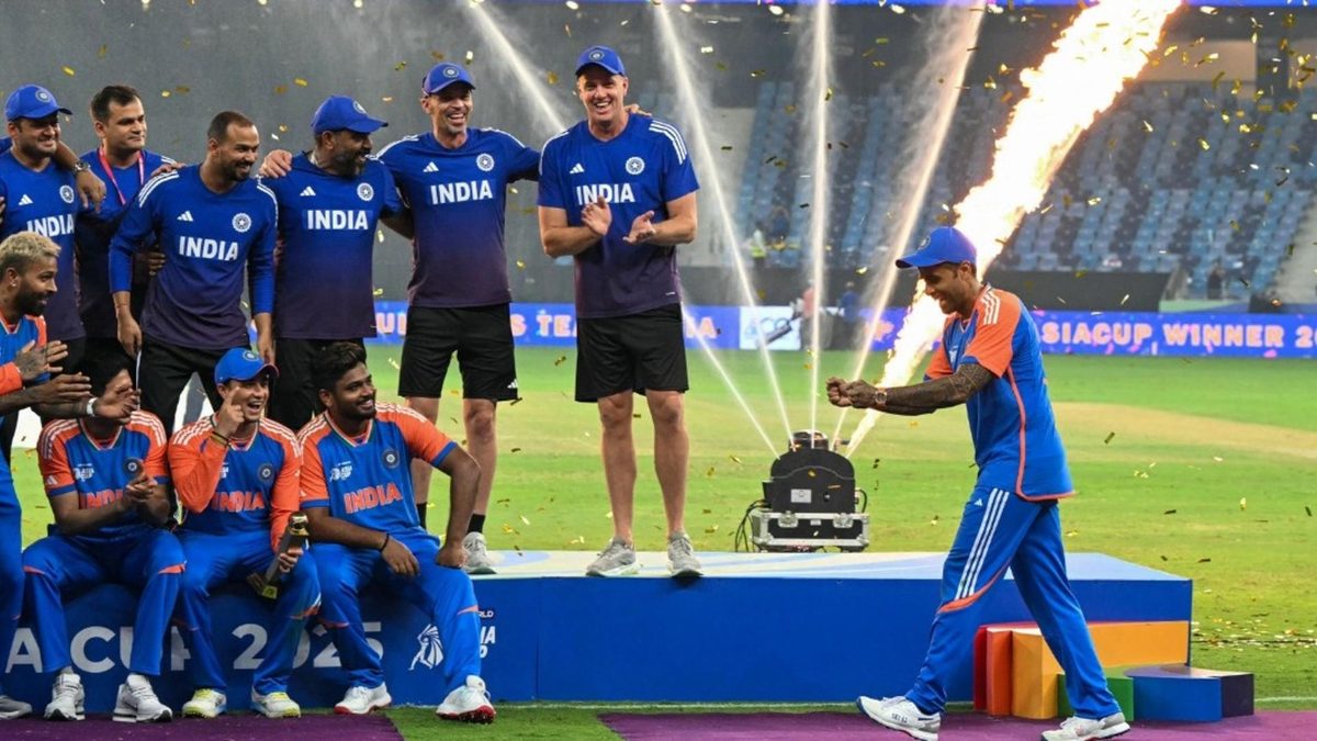 Suryakumar Yadav poses with an imaginary trophy