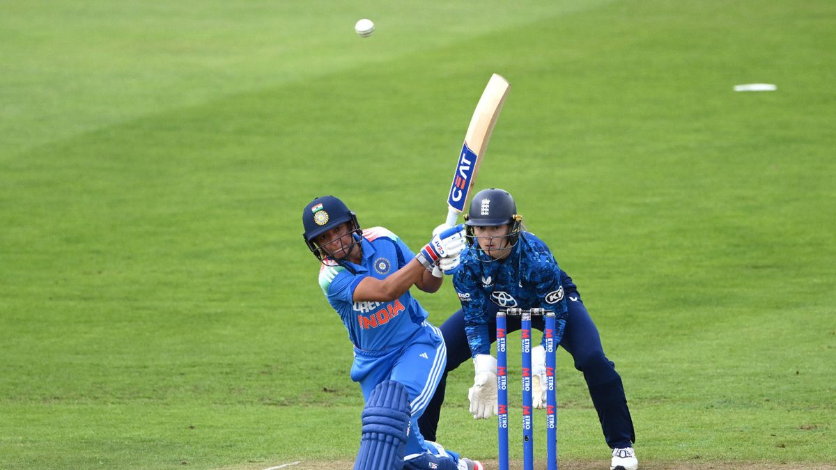 India batter Harmanpreet Kaur hits out watched by Amy Jones during the 3rd Women's Metro Bank ODI match between England and India at Banks Homes Riverside on July 22, 2025 in Chester-le-Street, England