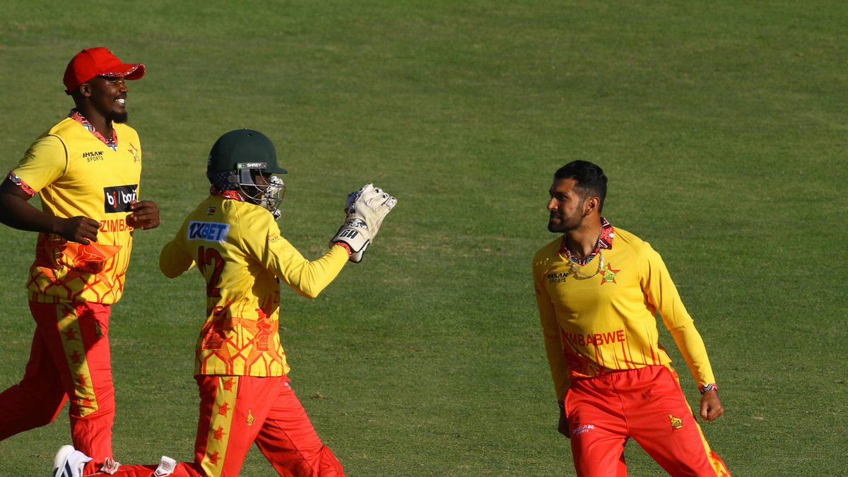 Zimbabwe's Sikandar Raza (R) celebrates with teammates after the dismissal of India's Shubman Gill (unseen) during the first T20 international cricket match between Zimbabwe and India at Harare Sports Club in Harare on July 6, 2024