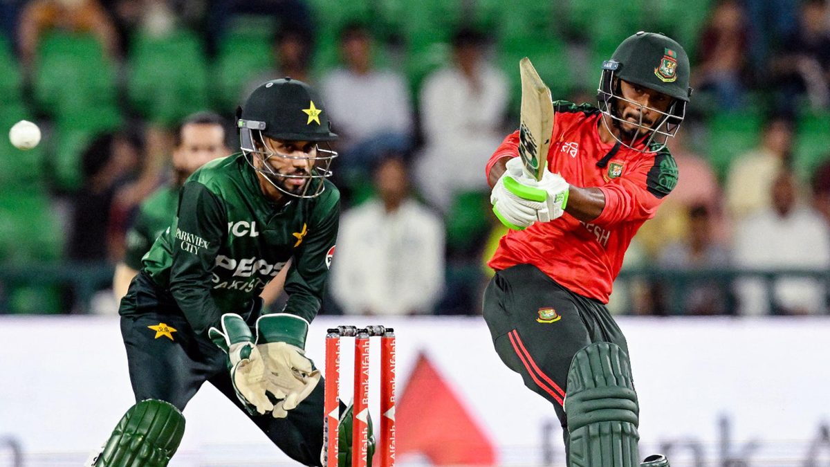 Bangladesh's Tanzid Hasan (R) plays a shot as Pakistan's wicketkeeper Mohammad Haris looks on during the third and final Twenty20 international cricket match between Pakistan and Bangladesh at the Gaddafi Cricket Stadium in Lahore on June 1, 2025