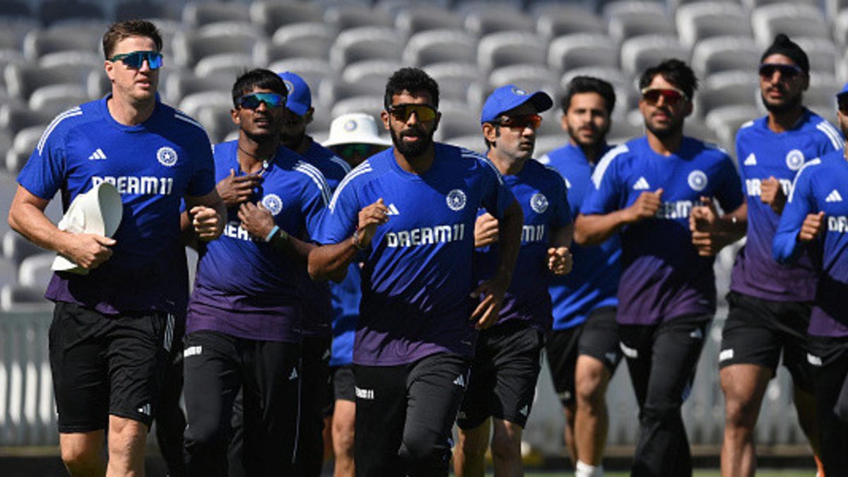 Jasprit Bumrah of India runs with Morne Morkel (L) and the team during a training session before the third Rothesay Test against England at Lord's Cricket Ground on July 08, 2025 in London, England