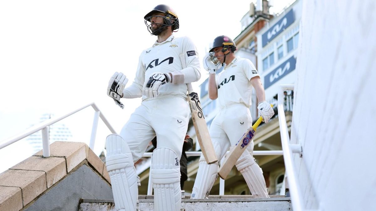 Surrey batters walk down the steps at The Oval