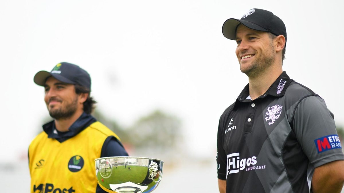 Somerset and Glamorgan captains pose next to the One Day Cup trophy as play is reduced to a 20-over per side game