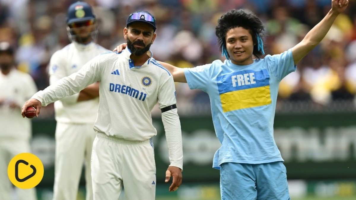 A spectator broke the security cordon to meet Virat Kohli at the MCG