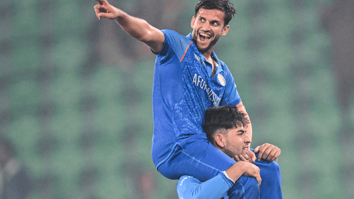 Azmatullah Omarzai celebrates after Afghanistan beat England