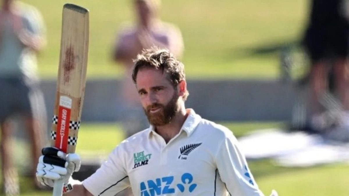 Kane Williamson raises his bat after reaching three figures against South Africa earlier in 2024