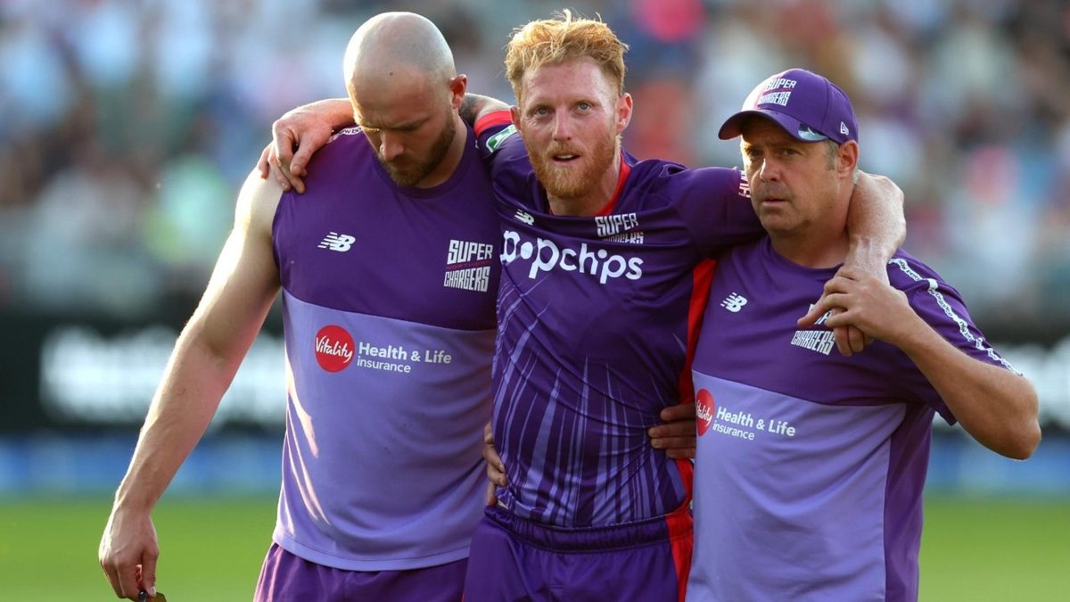 Ben Stokes is supported off the field during The Hundred