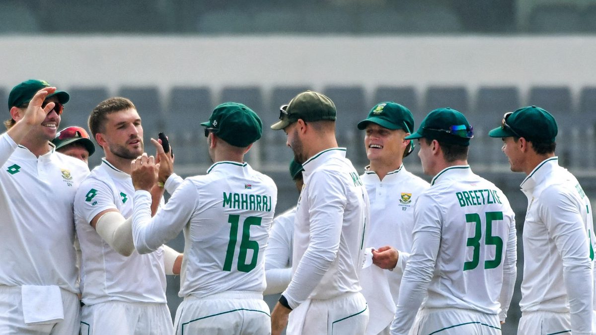 South Africa's Wiaan Mulder (2L) and Keshav Maharaj (3L) celebrate with teammates after taking the wicket of Bangladesh's captain Najmul Hossain Shanto during the first day of the first Test cricket match between Bangladesh and South Africa at the Sher-e-Bangla National Cricket Stadium in Dhaka on October 21, 2024