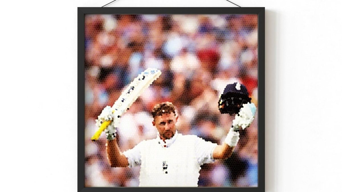 Joe Root raises his bat in a portrait picture