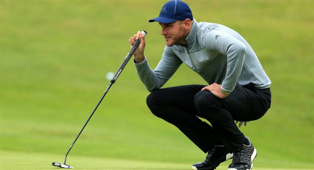 Stuart Broad struck in lower back by golf ball