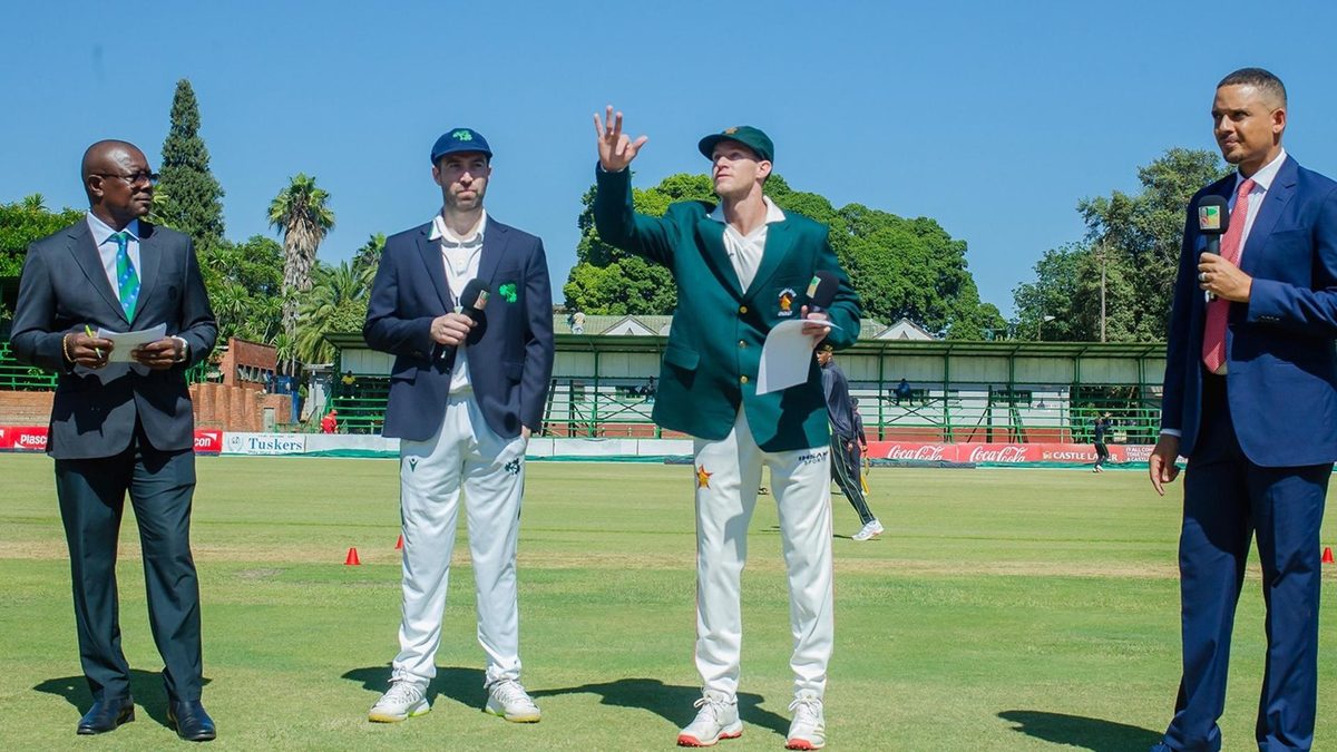 Jonathan Campbell tossing the coin ahead of play in the ZIM v IRE Test 2025