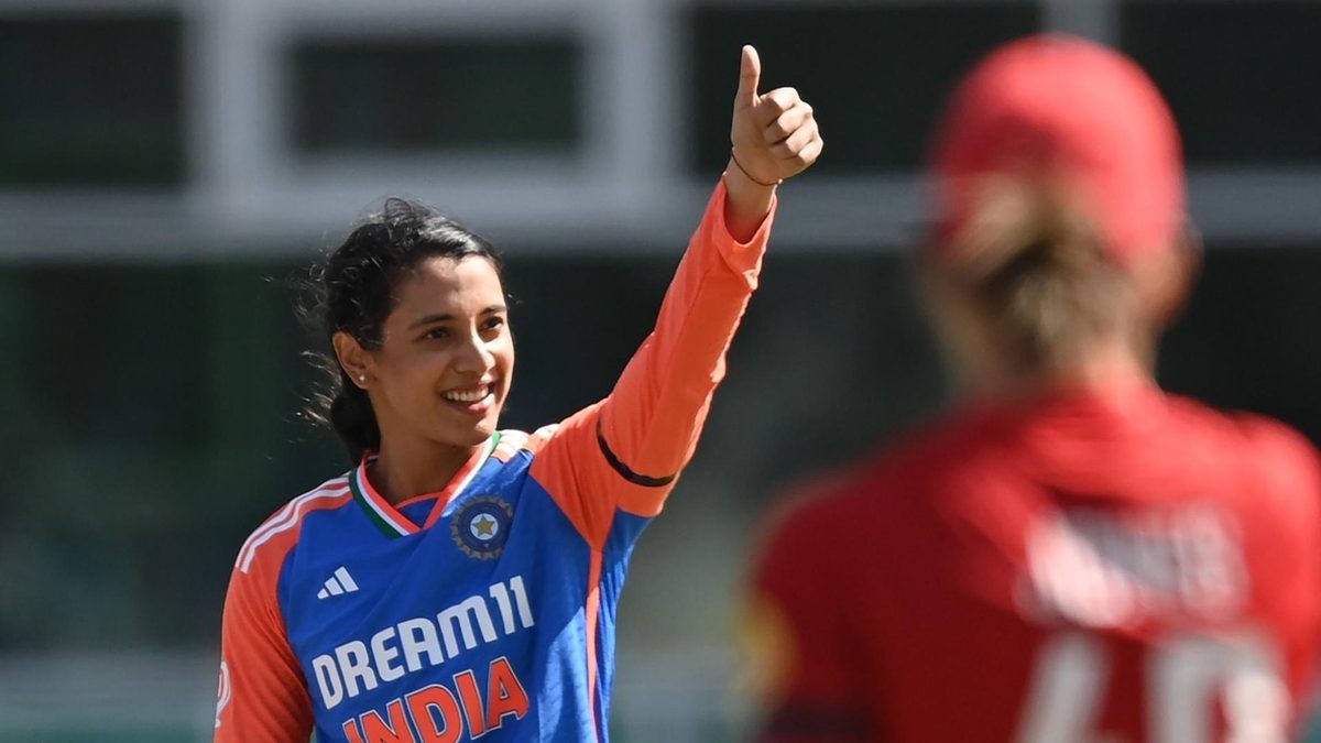 Smriti Mandhana salutes the dressing room after reaching her first T20I century