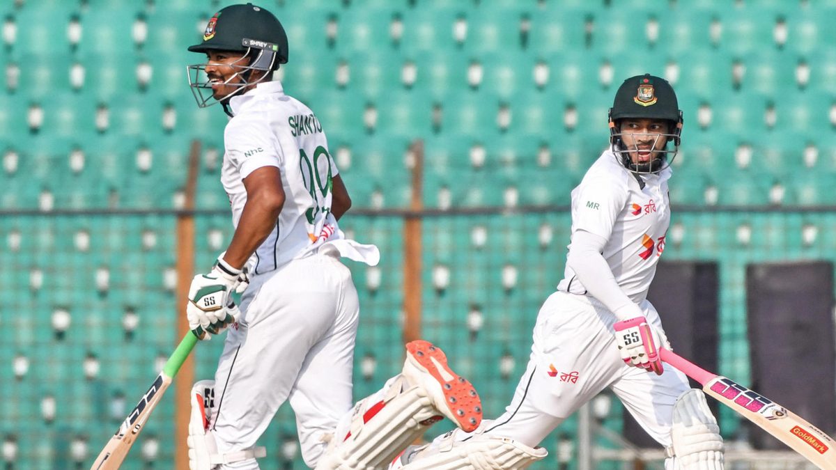 Bangladesh's Mushfiqur Rahim (R) and captain Najmul Hossain Shanto run between the wickets during the third day of the second Test cricket match between Bangladesh and South Africa at the Zahur Ahmed Chowdhury Stadium in Chittagong on October 31, 2024
