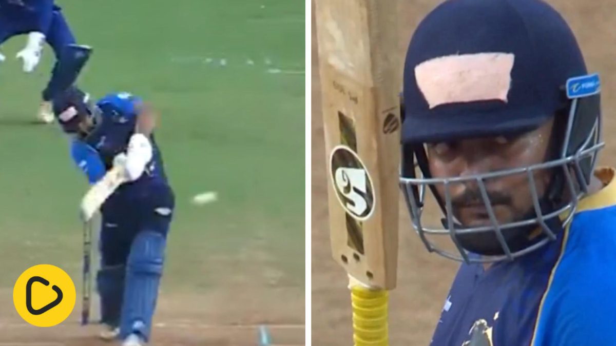 Prithvi Shaw raises his bat after completing his fifty