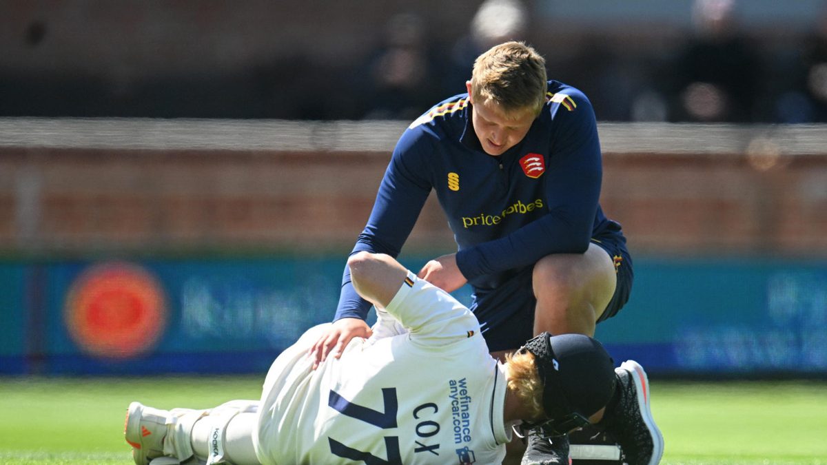 Jordan Cox of Essex receives medical attention during Day Three of the Rothesay County Championship Division One match between Somerset and Essex at The Cooper Associates County Ground on May 04, 2025 in Taunton, England