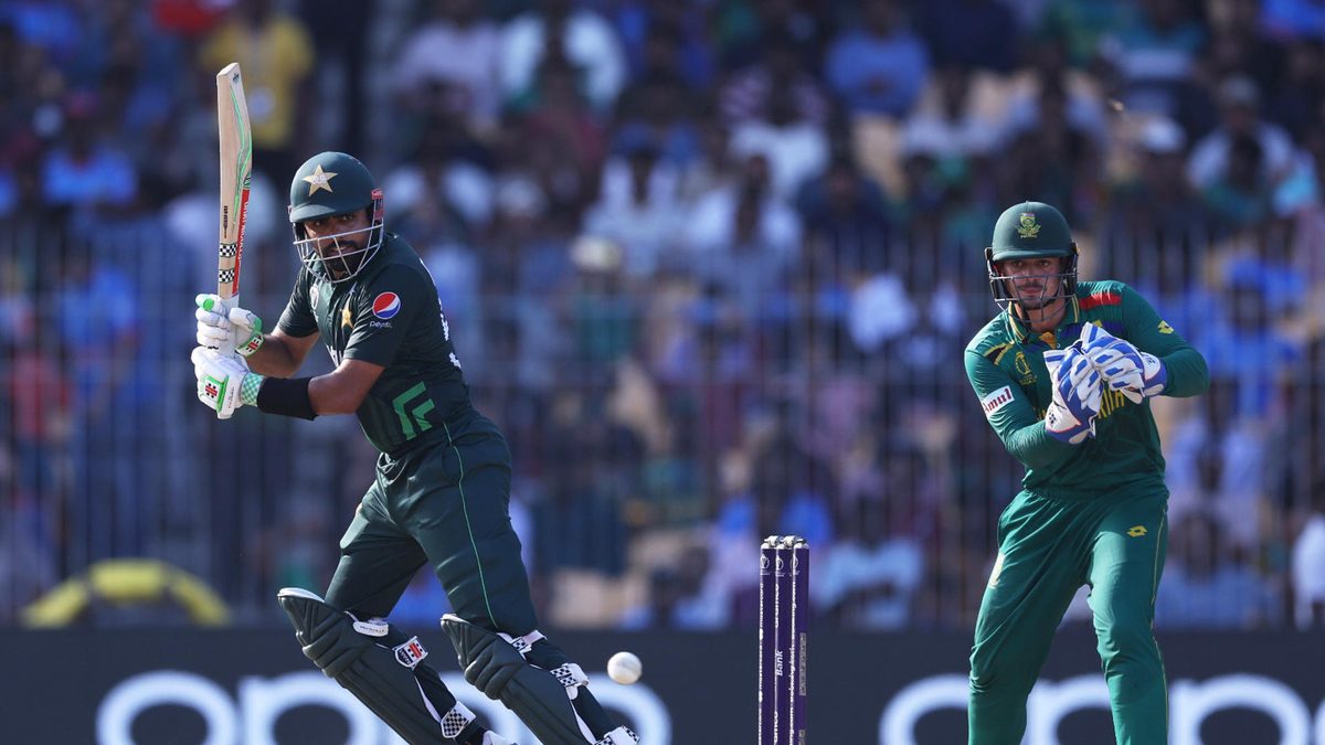 Babar Azam of Pakistan plays a shot as Quinton de Kock of South Africa keeps during the ICC Men's Cricket World Cup India 2023 between Pakistan and South Africa at MA Chidambaram Stadium on October 27, 2023 in Chennai, India