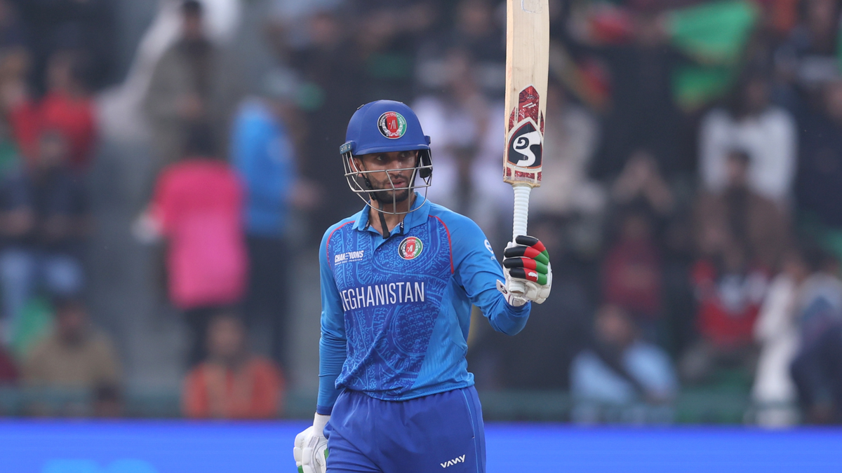 Azmatullah Omarzai of Afghanistan salutes the crowd after reaching his half century
