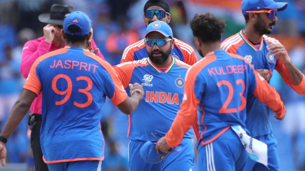 Rohit Sharma of India (C) greets his teammates as they celebrate their side's victory in the ICC Men's T20 Cricket World Cup West Indies & USA 2024 Super Eight match between India and Bangladesh at Sir Vivian Richards Stadium on June 22, 2024 in Antigua, Antigua and Barbuda.