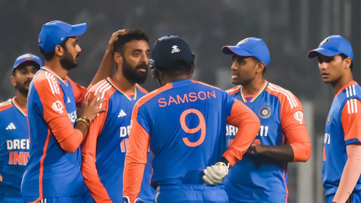 Varun Chakaravarthy of India celebrates with teammate Washington Sundar after dismissing Liam Livingstone of England during the T20 International match between India and England at Eden Gardens in Kolkata, India, on January 22, 2025